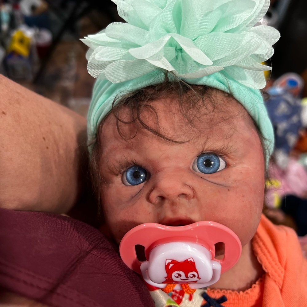 18.5” full silicone Artist painted mottling, veins Also rooted eyelashes/hair.